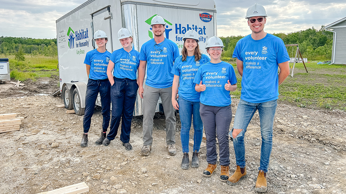 Bruce Power corporate social responsibility fund Bruce Power Habitat for Humanity volunteers in hardhats.